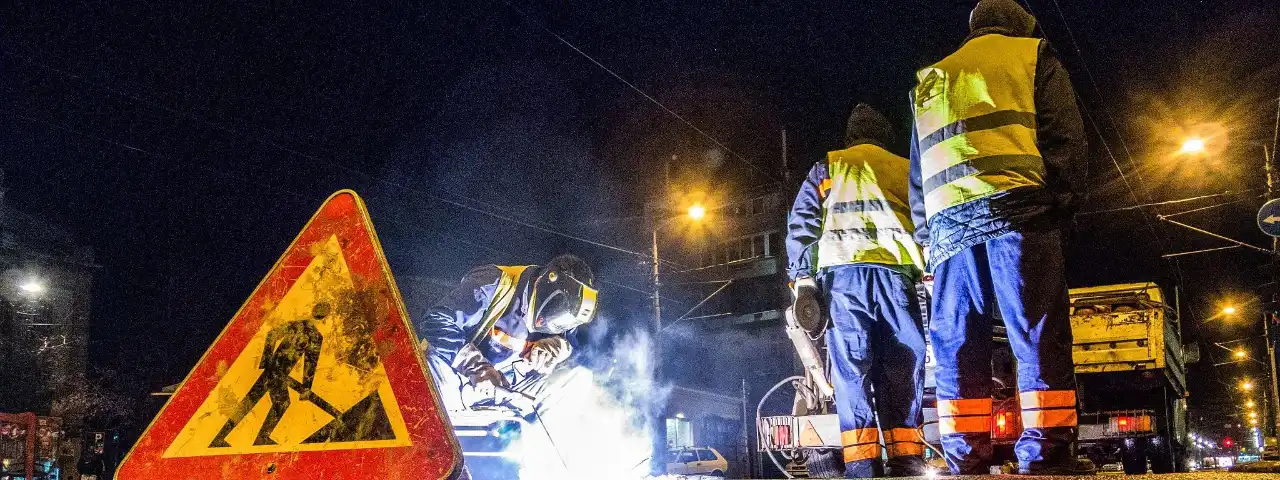 Workers blocking the road for maintenance work